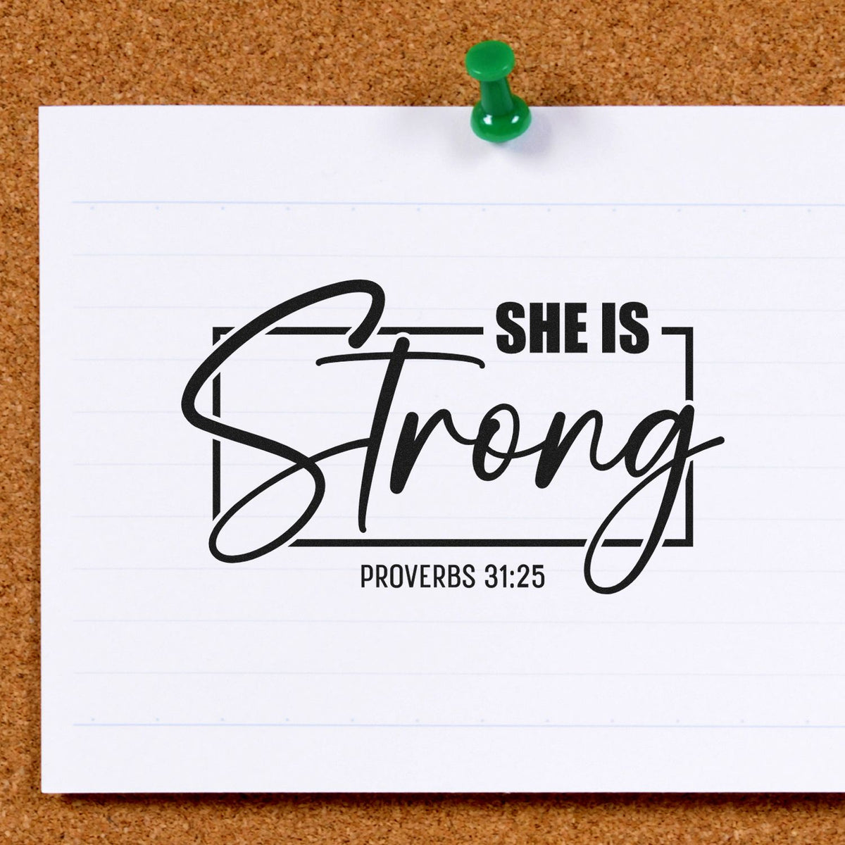 Black She Is Strong Proverbs 31:25 stamp and seal design on white paper, pinned with a green pushpin.