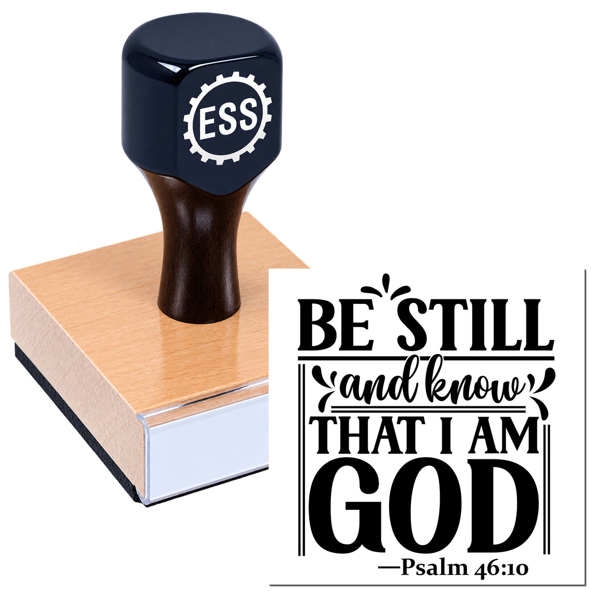 Black self-inking stamp and seal with wooden base, featuring bold white-and-black "Be Still and know that I am God" Psalm 46:10 text.