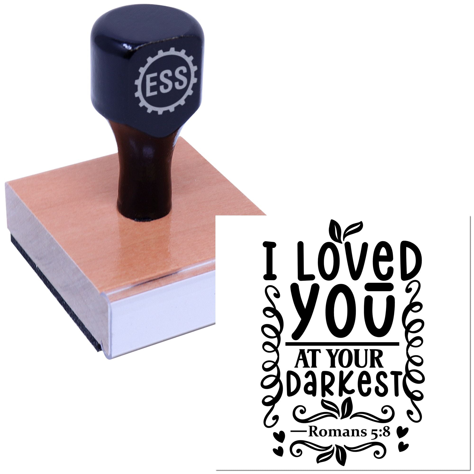 Dark blue ESS rubber stamp on wood base with black seal reading I loved you at your darkest and Romans 5:8
