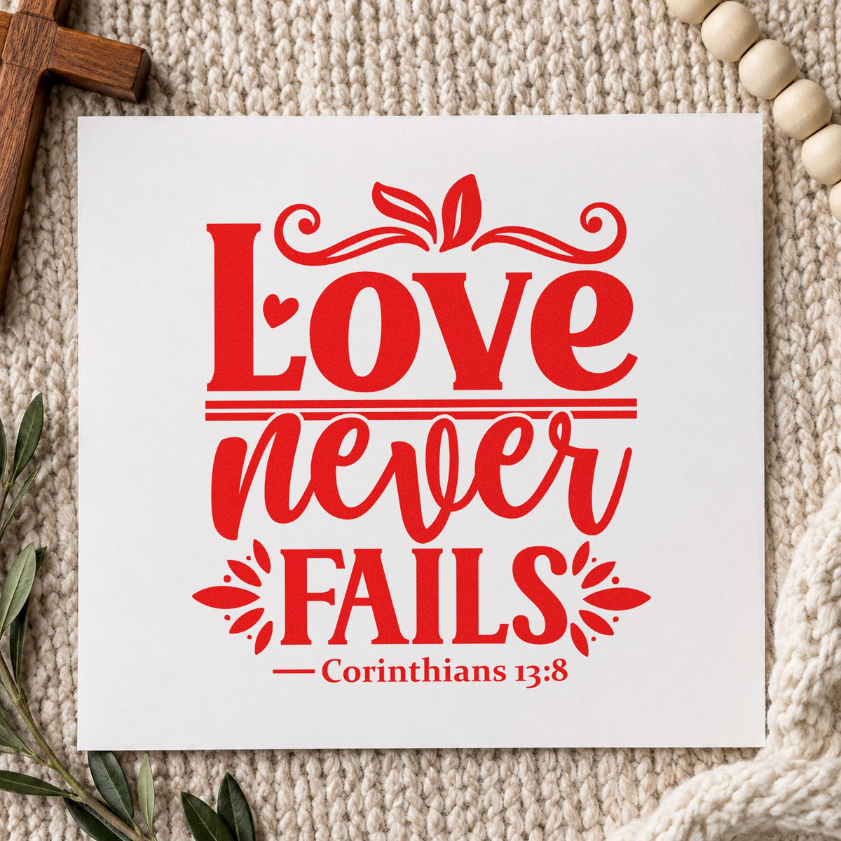 Love Never Fails rubber stamp shown in red ink, stamped for projects such as sympathy cards.