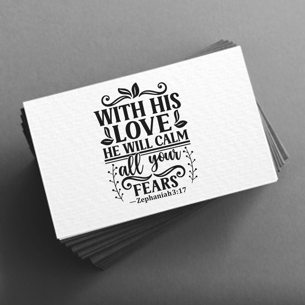 Black custom stamp and seal design with Bible verse, decorative leaves, on white card stack over gray background.