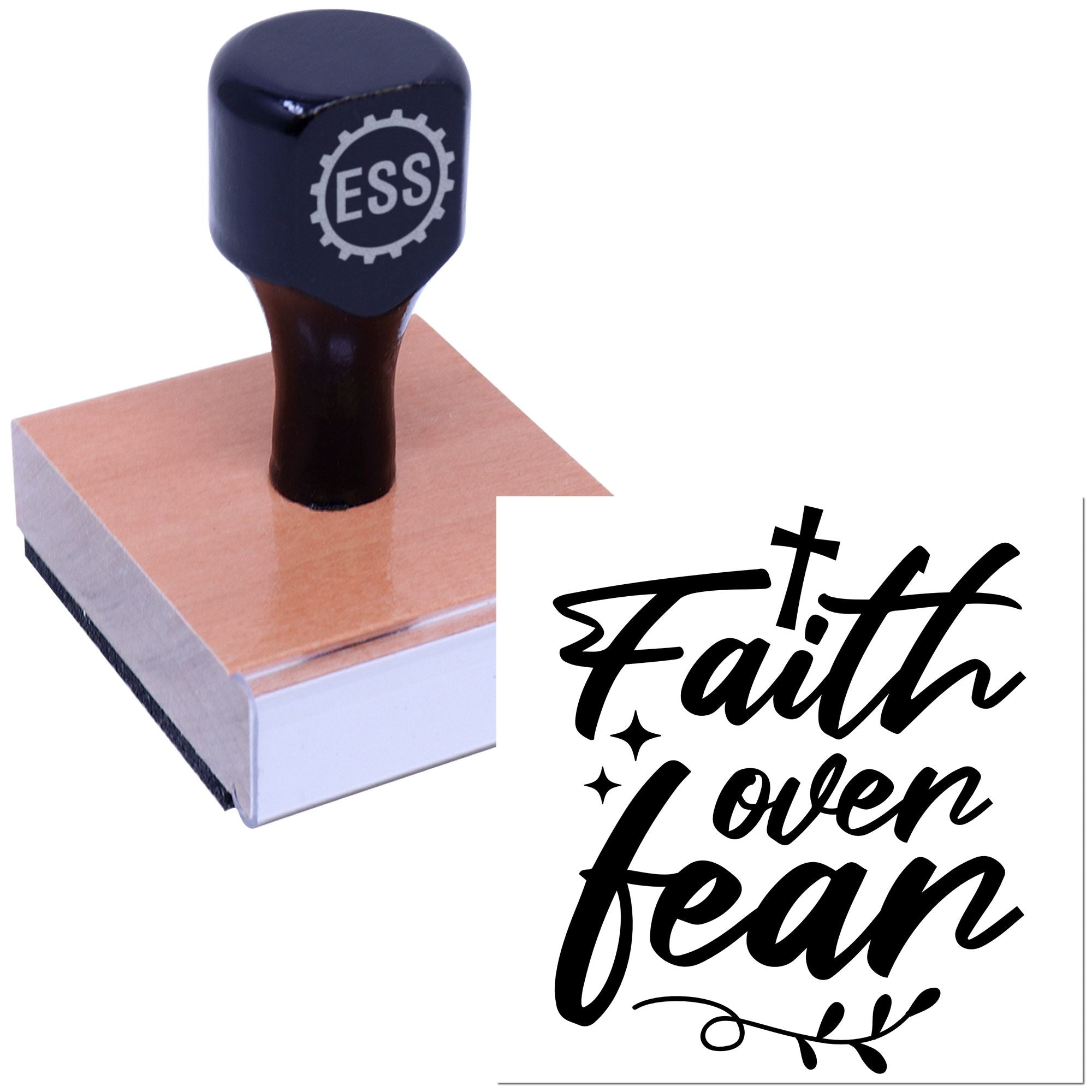 Black ESS rubber stamp on pink wood block with Faith over fear seal design.