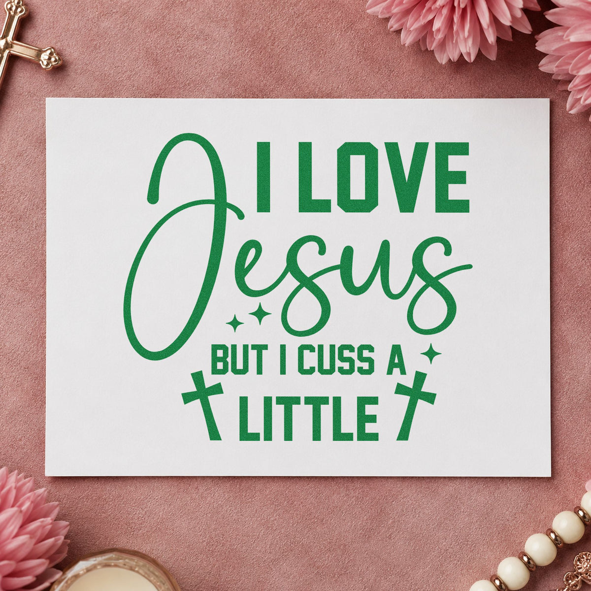 I Love Jesus but Cuss craft stamp imprint in green ink on a handmade project, one idea being white elephant gifts.