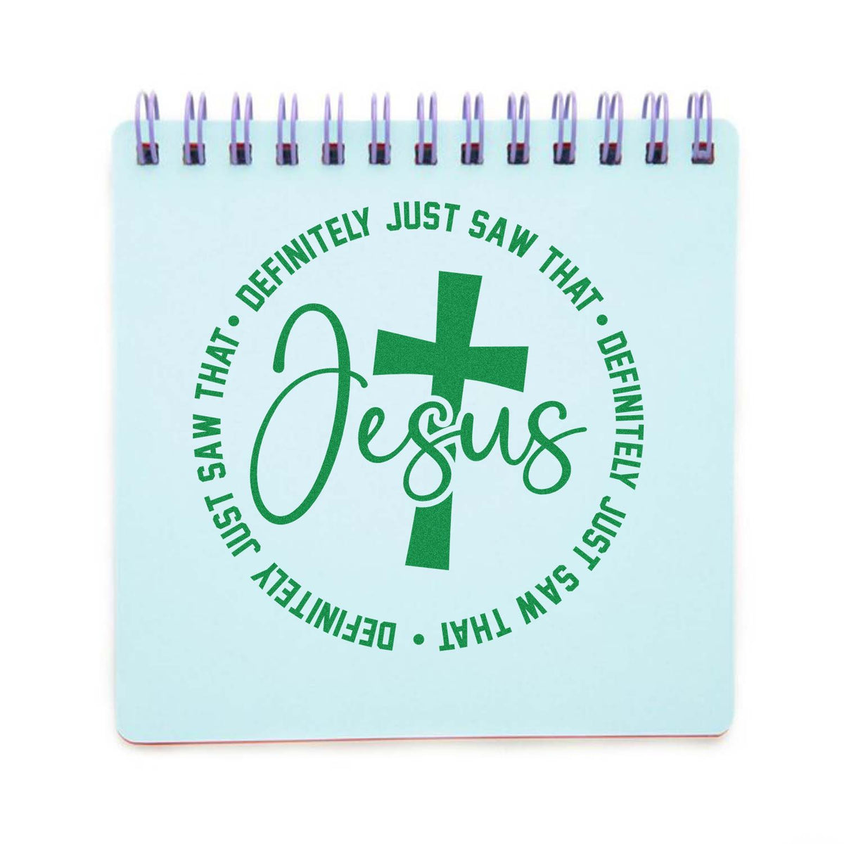 Light blue spiral stamp-and-seal pad with green Jesus cross seal and circular text.