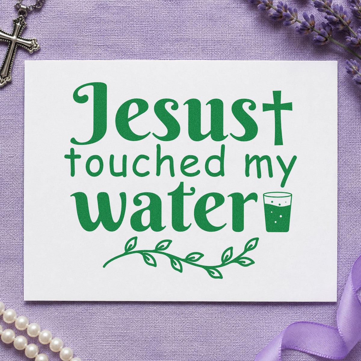 Jesus Touched My Water craft stamp imprint in green ink on a handmade project, one idea being gift bag stamping.