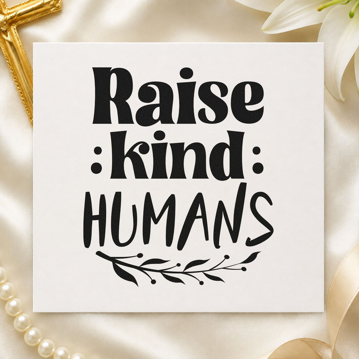 Raise Kind Humans rubber stamp printed in black ink, ready for parenting cards and similar paper crafts.