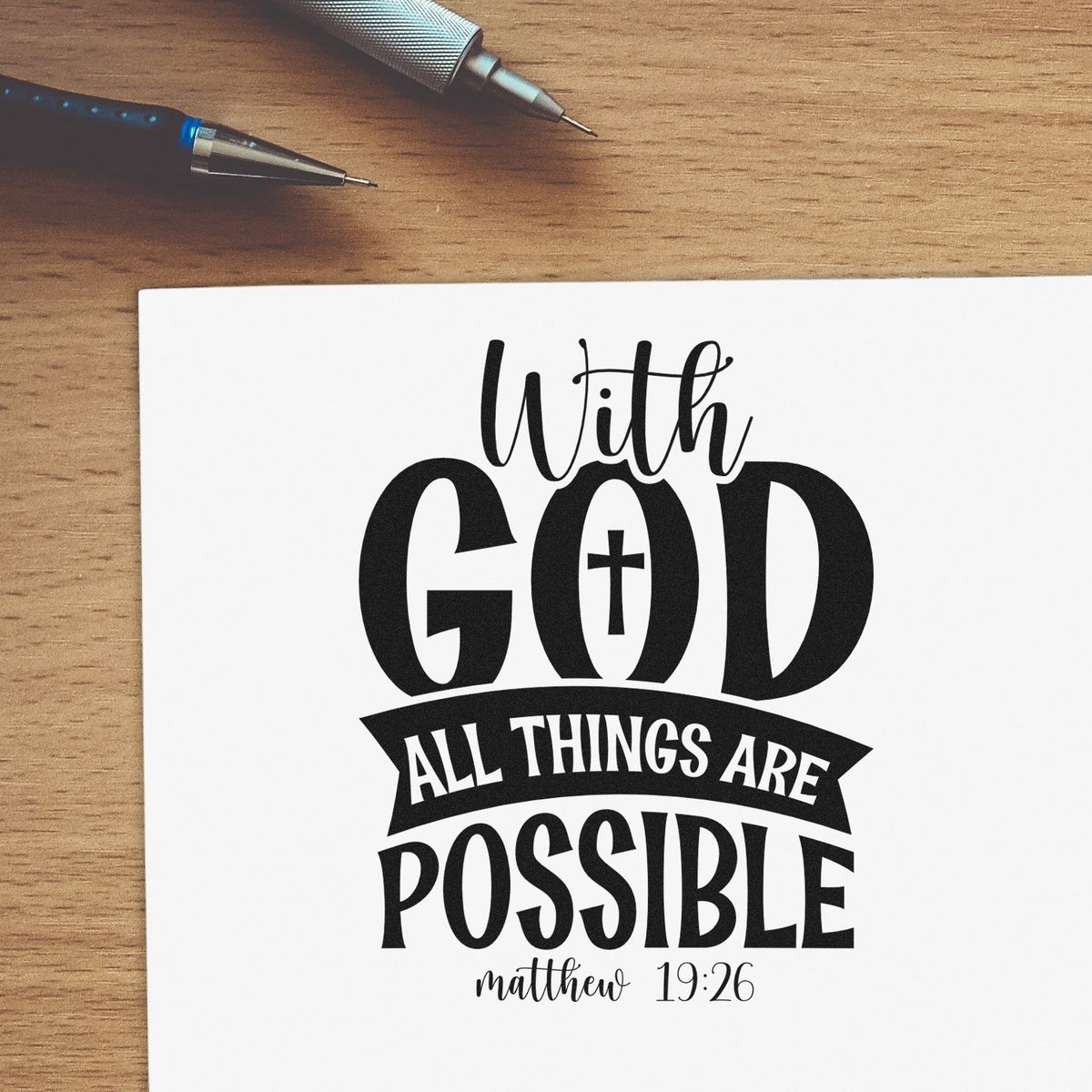 With God All Things Are Possible Solid Banner Pre-Inked Stamp – Slim imprint stamped in black ink. A cross fills the O in "God," above a dark "All things are" banner, "Possible," and Matthew 19:26.