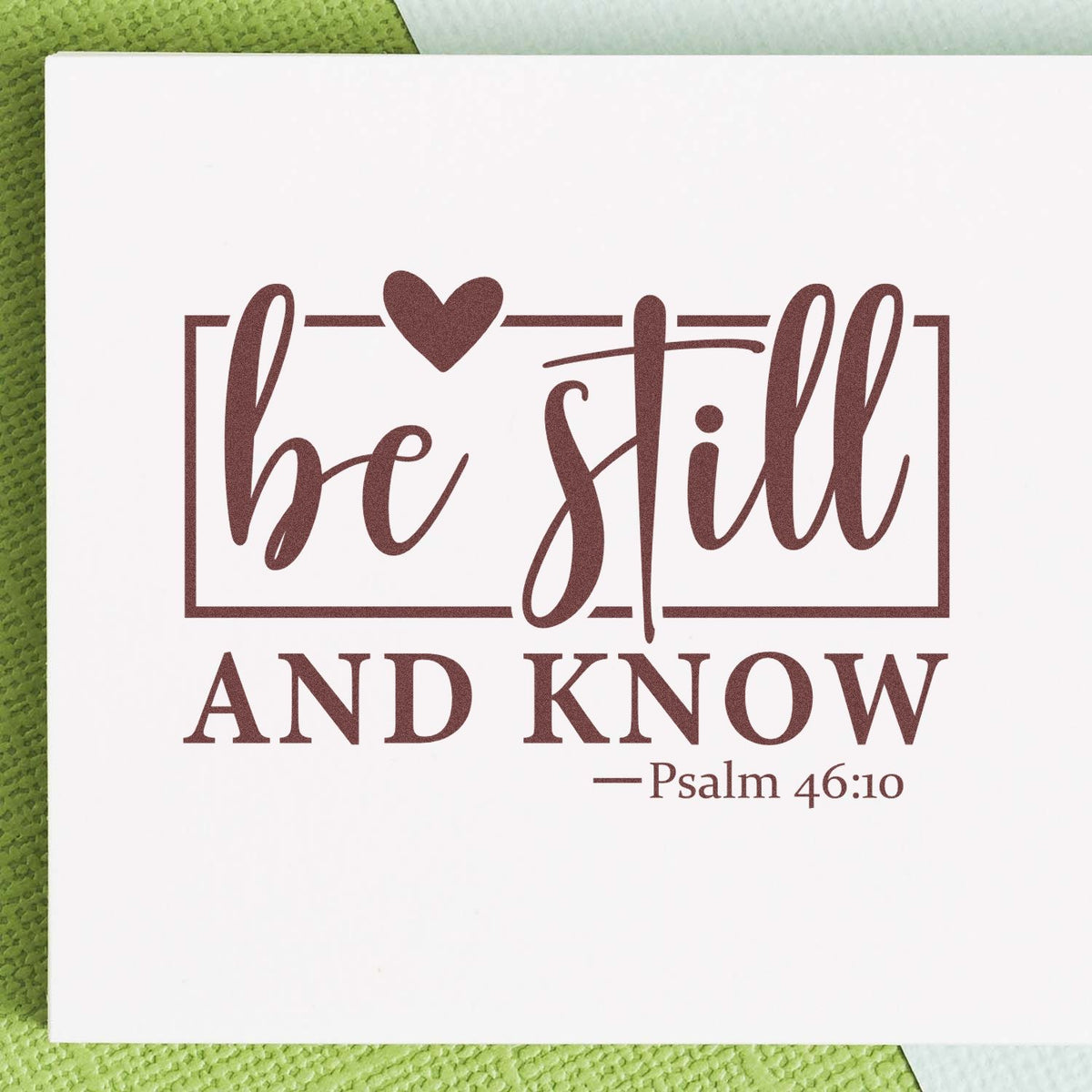 Brown be still and know Psalm 46:10 rubber stamp design with heart and framed script on white card.