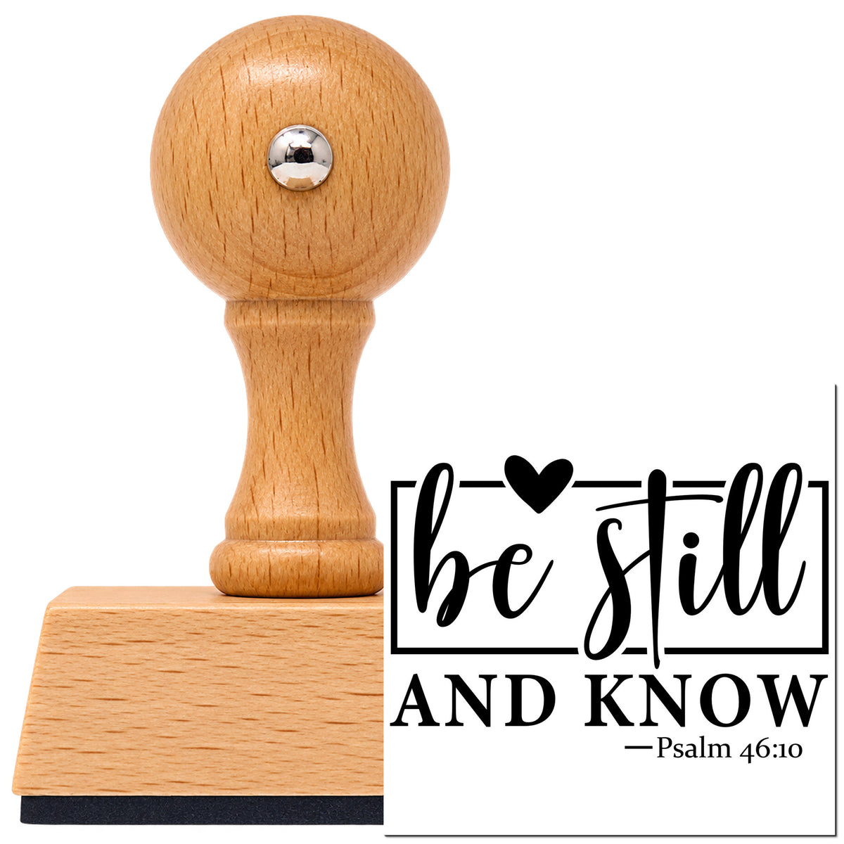 Vintage Pro beech wood stamp with a round knob handle, shown with its black Be Still Heart Frame imprint on white.
