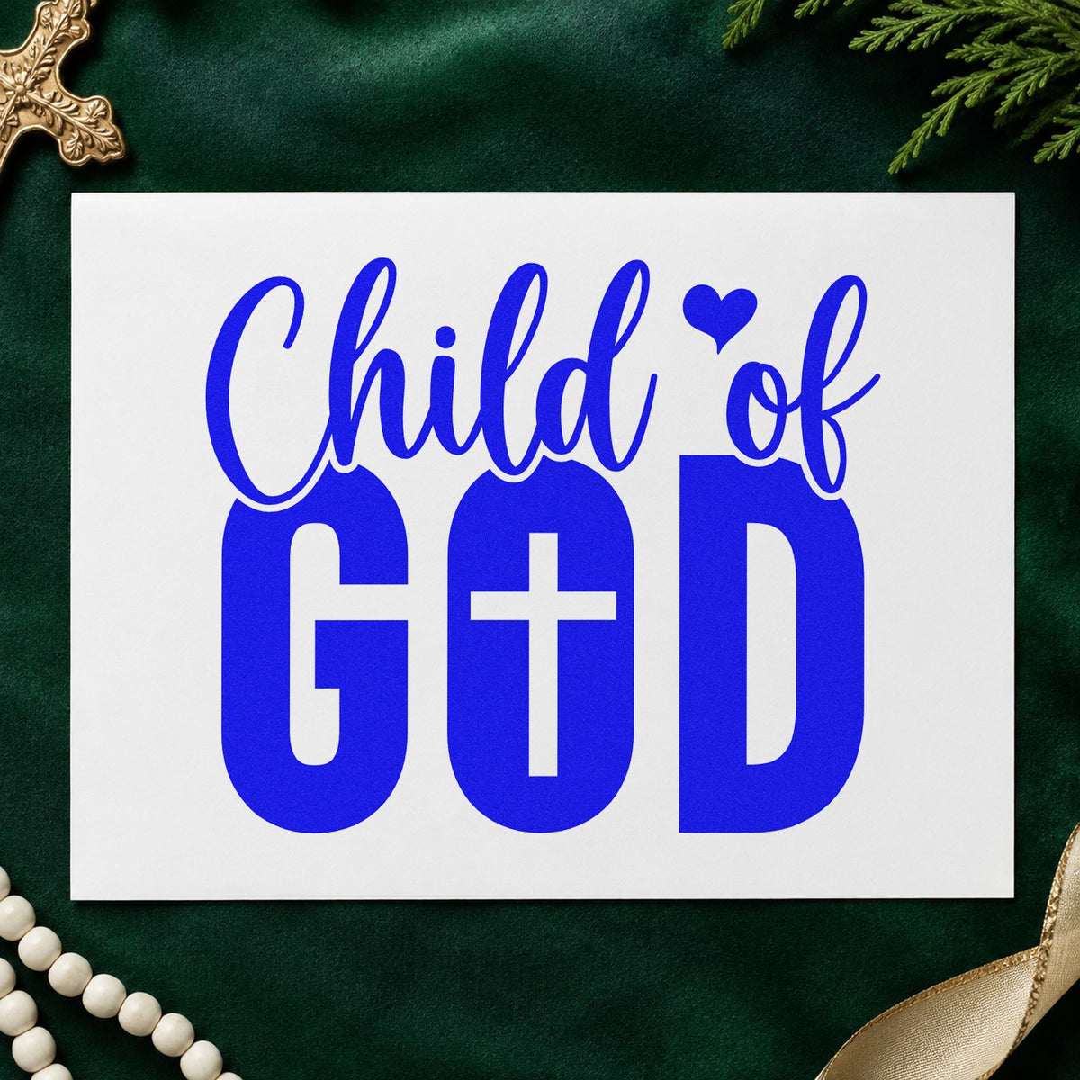 Child of God craft stamp imprinted in blue ink on paper, a design suited to newborn scrapbooks.