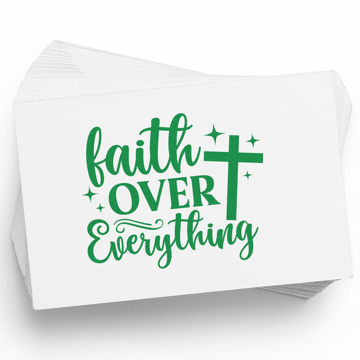 Stack of white stamp and seal cards with green faith over everything text, cross, and sparkles.