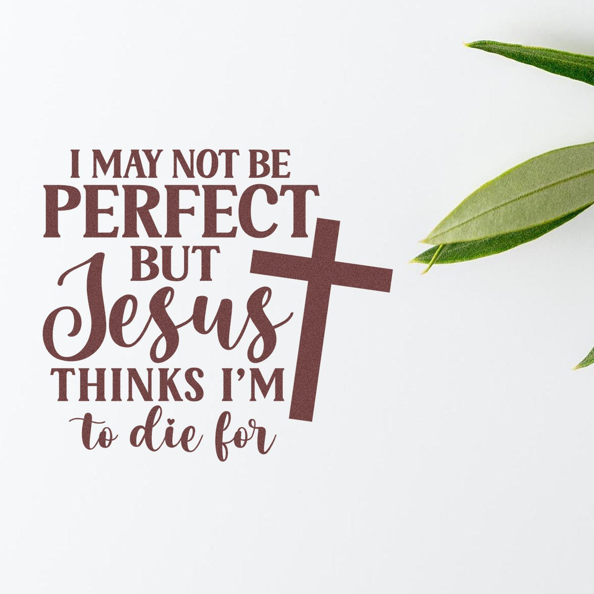 Brown stamp and seal with Christian quote, I may not be perfect..., cross, and green leaves on white.