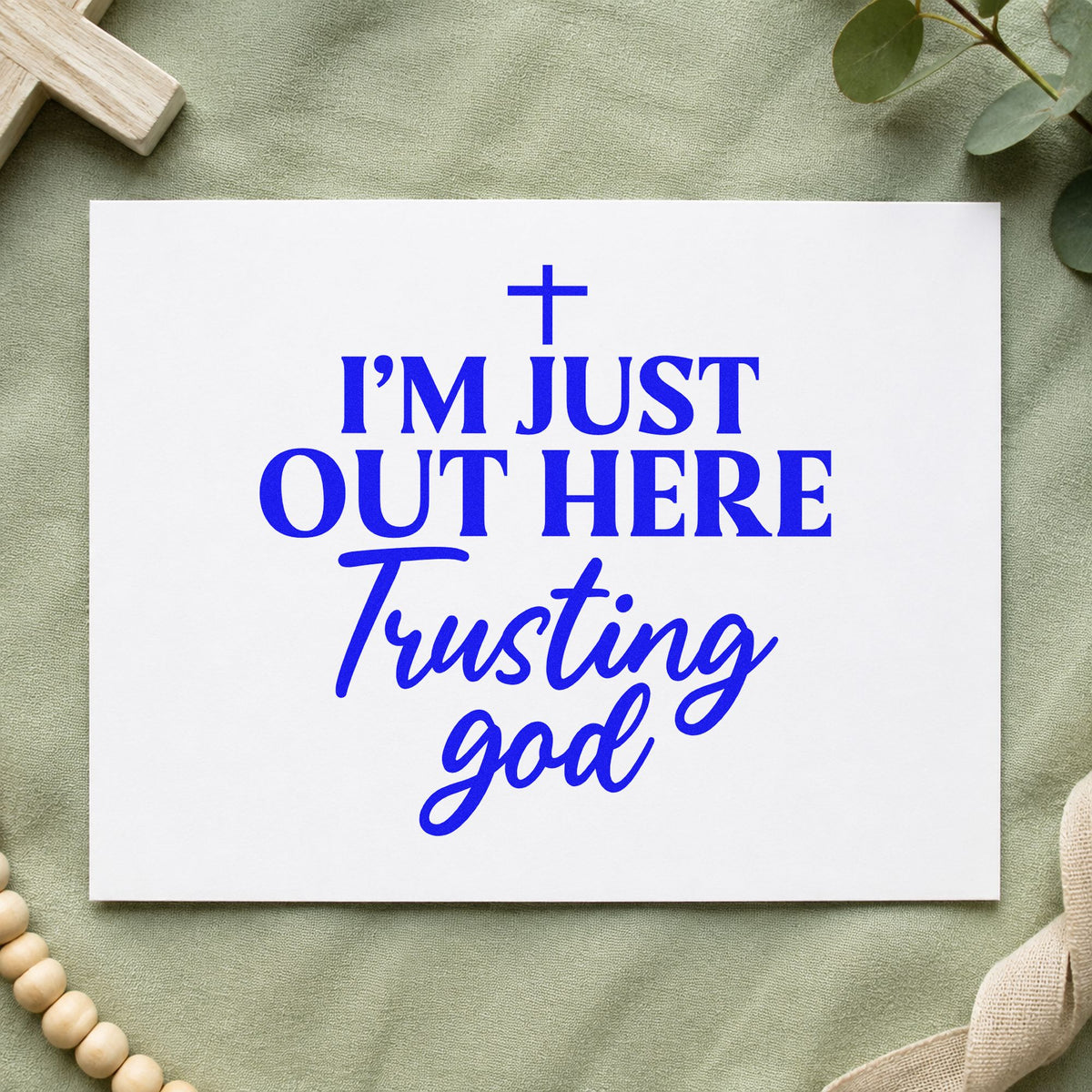 Out Here Trusting God craft stamp in blue ink on cardstock, an easy option for tee transfers.