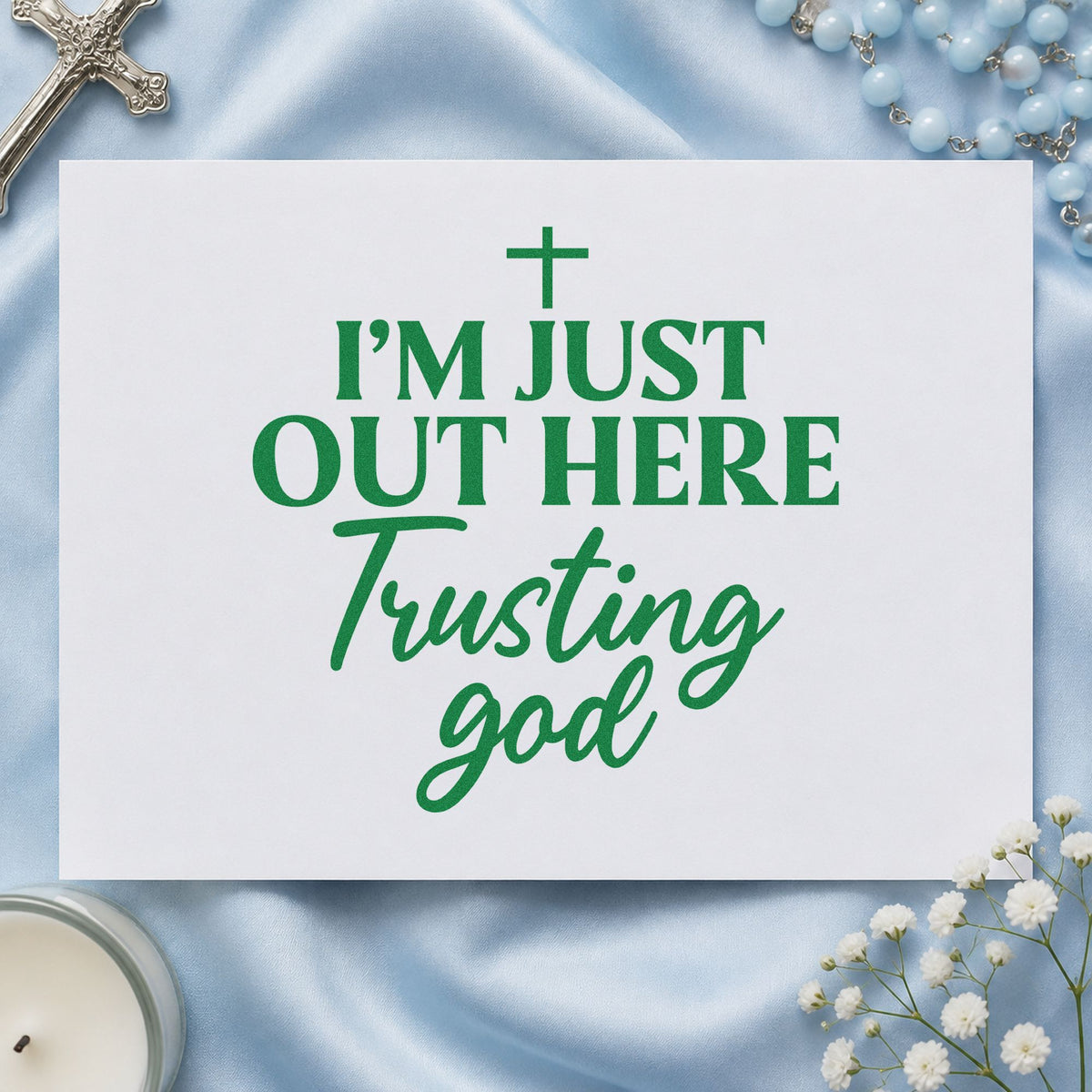Out Here Trusting God craft stamp imprint in green ink on a handmade project, one idea being planner cover stamping.