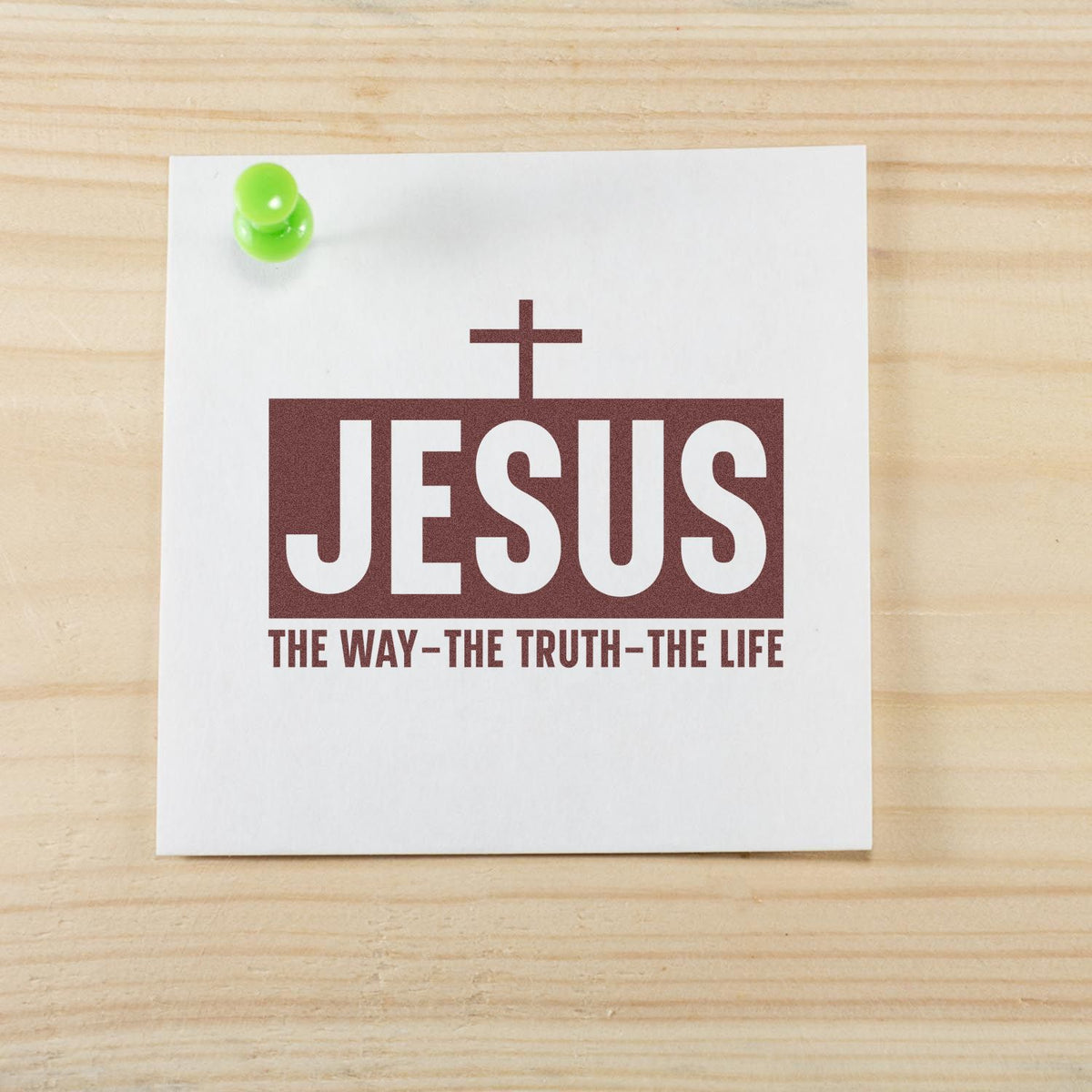 Brown JESUS stamp seal with cross and The WayThe TruthThe Life on white card, pinned with a green pushpin.