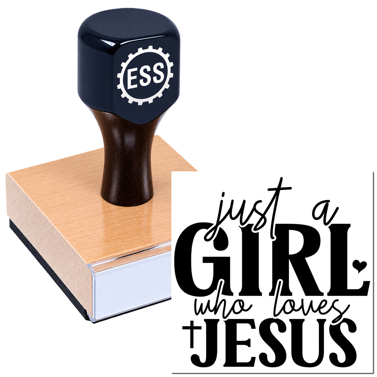 Black ESSI rubber stamp and seal on a pink wooden block, stamping a bold black "just a GIRL who loves JESUS" design.