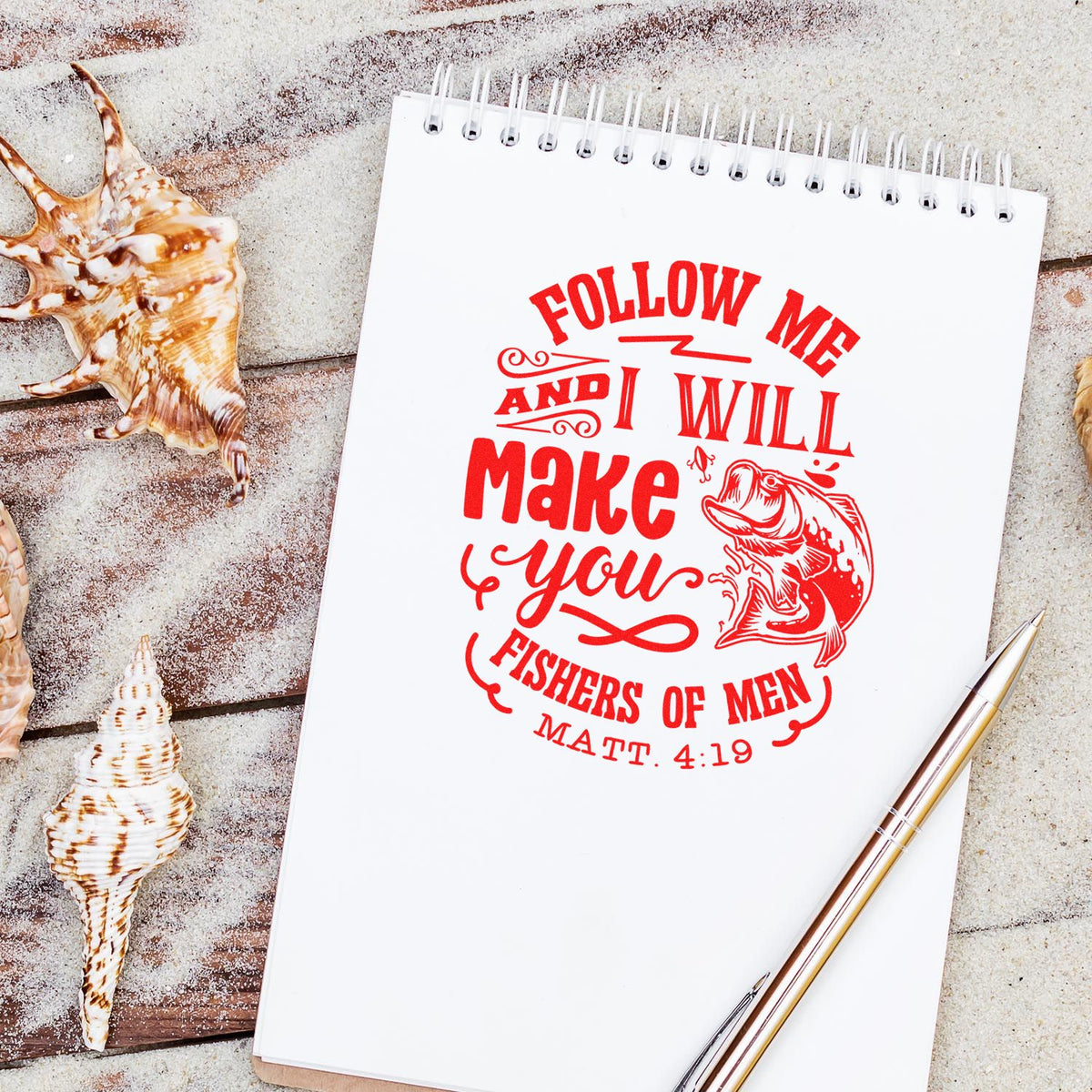 Red stamp and seal design on white spiral notebook, reading Follow me and I will make you fishers of men, with fish graphic.