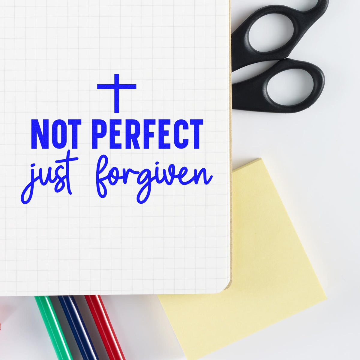Not Perfect Just Forgiven rubber stamp shown in blue ink, stamped for projects such as confession journal covers.