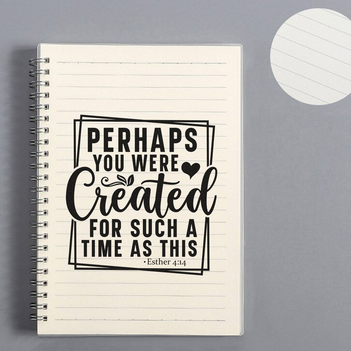 Black scripture stamp/seal design on a cream lined notebook page with heart, Esther 4:14, on a gray background.