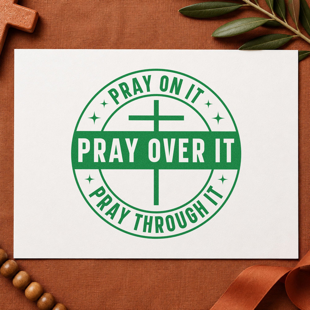 Pray on It Badge craft stamp imprint in green ink on a handmade project, one idea being journal cover stamping.