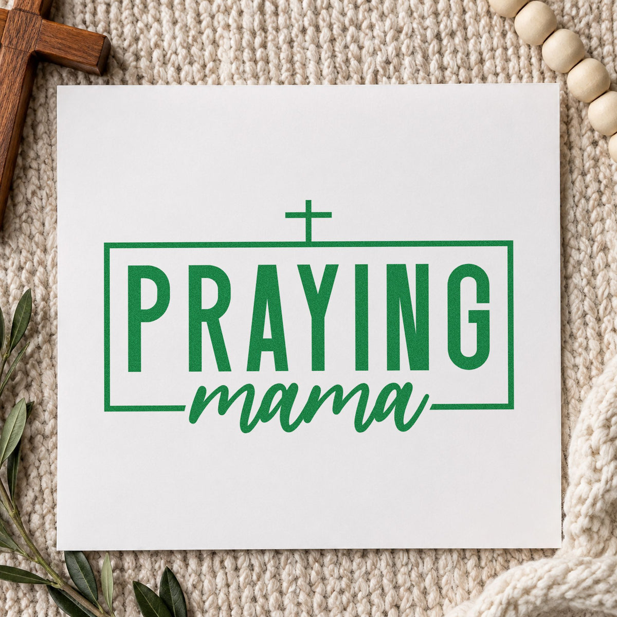 Praying Mama craft stamp imprint in green ink on a handmade project, one idea being prayer journal covers.