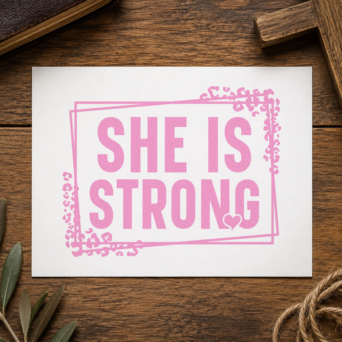She Is Strong craft stamp in purple ink on cardstock, an easy option for postpartum care kits.
