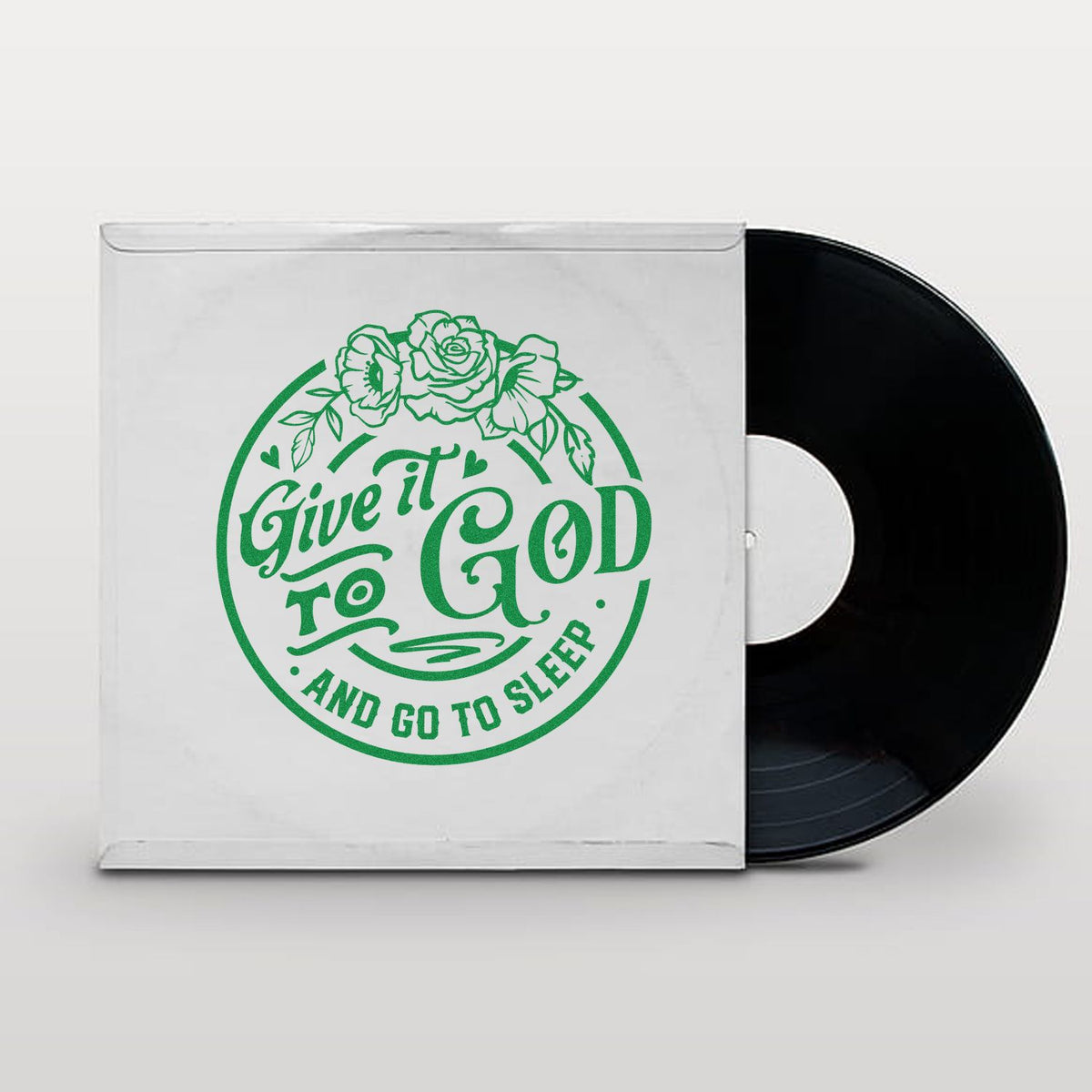 White vinyl sleeve with green floral stamp design reading Give it to God and go to sleep, shown with a black record.