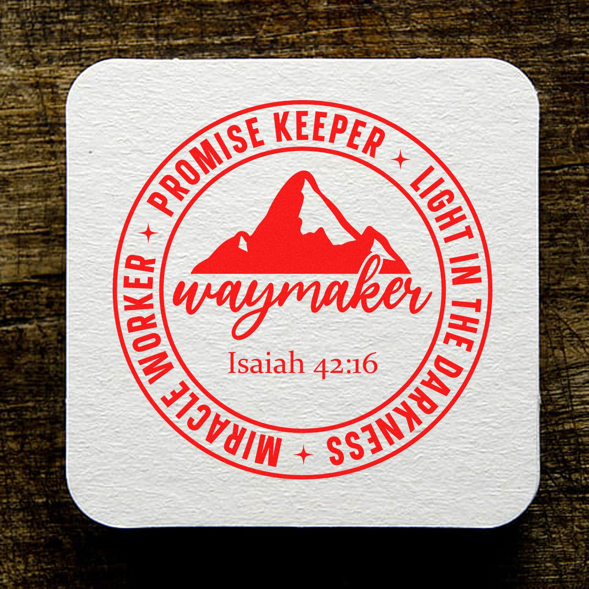 Red custom stamp seal on white textured square, with mountain logo and text Promise Keeper, Light in the Darkness, Waymaker Isaiah 42:16.