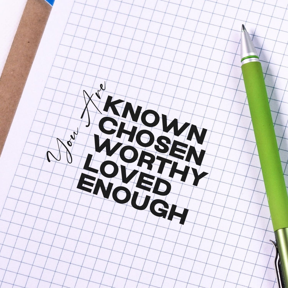 Vintage Pro You Are Known And Loved Premium Wooden Stamp imprint stamped in black ink. Vertical "You are" script accompanies stacked "Known, chosen, worthy, loved, enough" lettering.