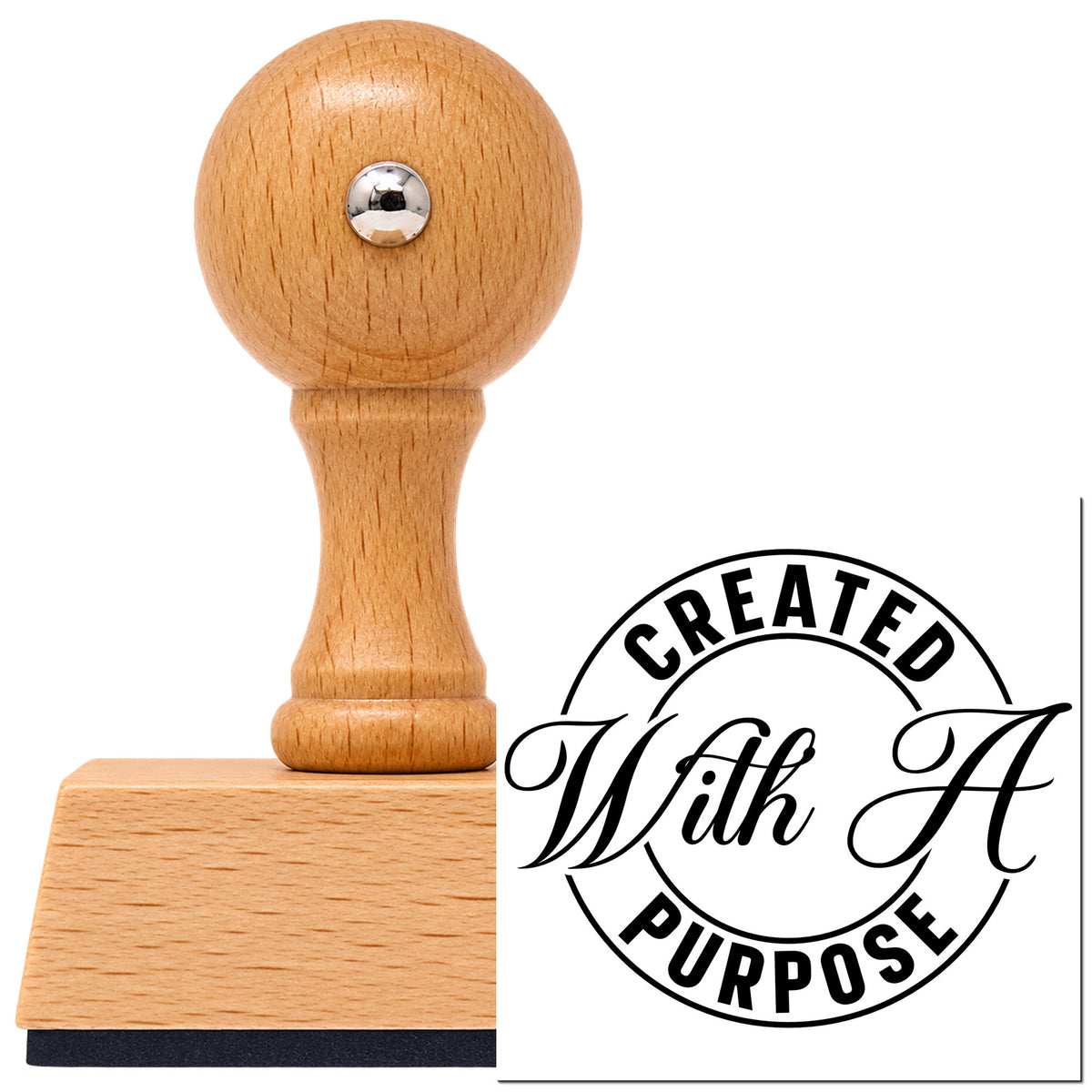 Vintage Pro beech wood stamp with a round knob handle, shown with its black Created With A Purpose Emblem imprint on white.