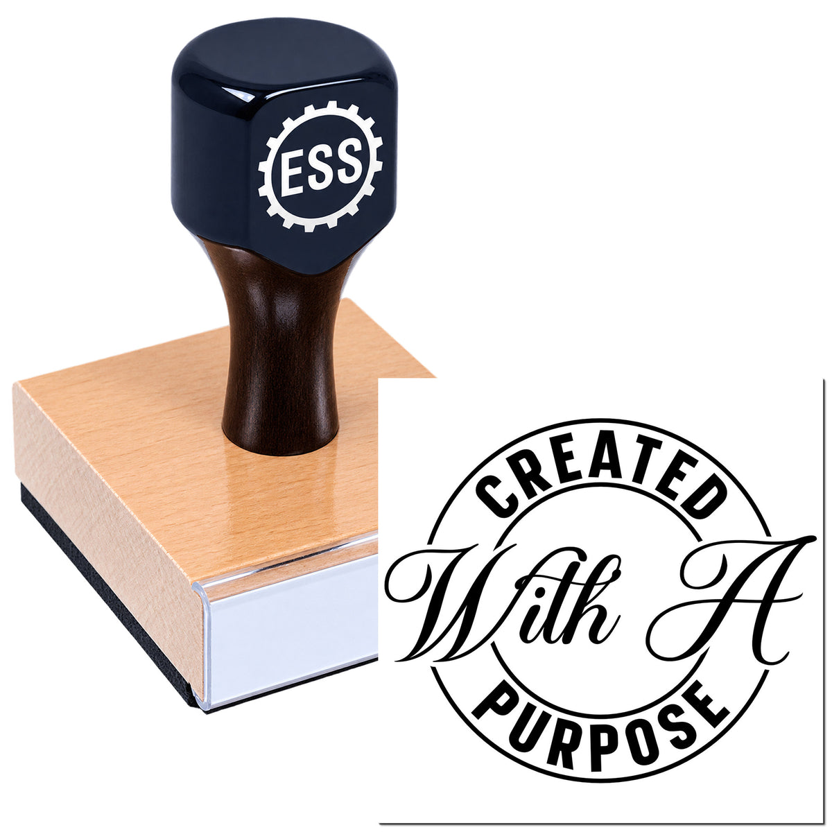 Black ESS rubber stamp on a wooden base, with a circular "Created With A Purpose" seal in black and white.