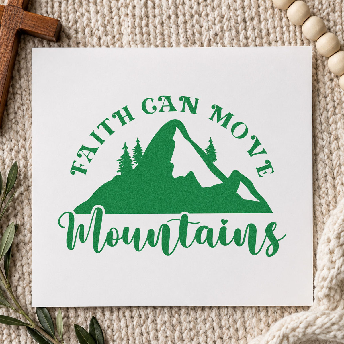 Faith Moves Mountains Silhouette craft stamp imprint in green ink on a handmade project, one idea being trail journal covers.