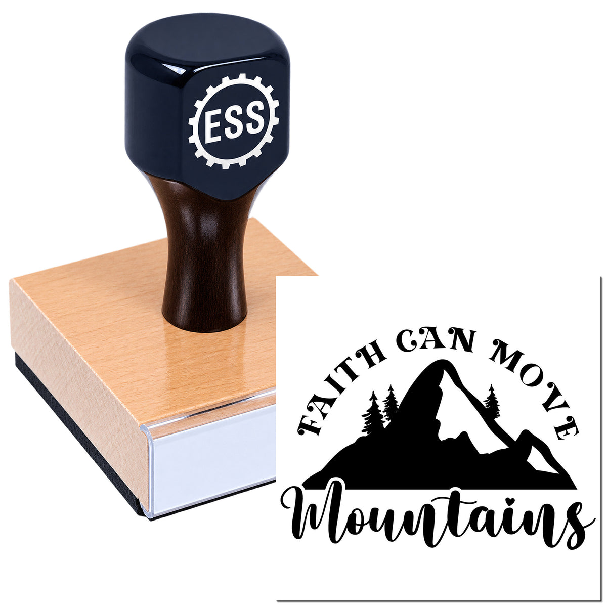 Black ESS rubber stamp on wooden base beside custom seal reading Faith Can Move Mountains with mountain silhouette.