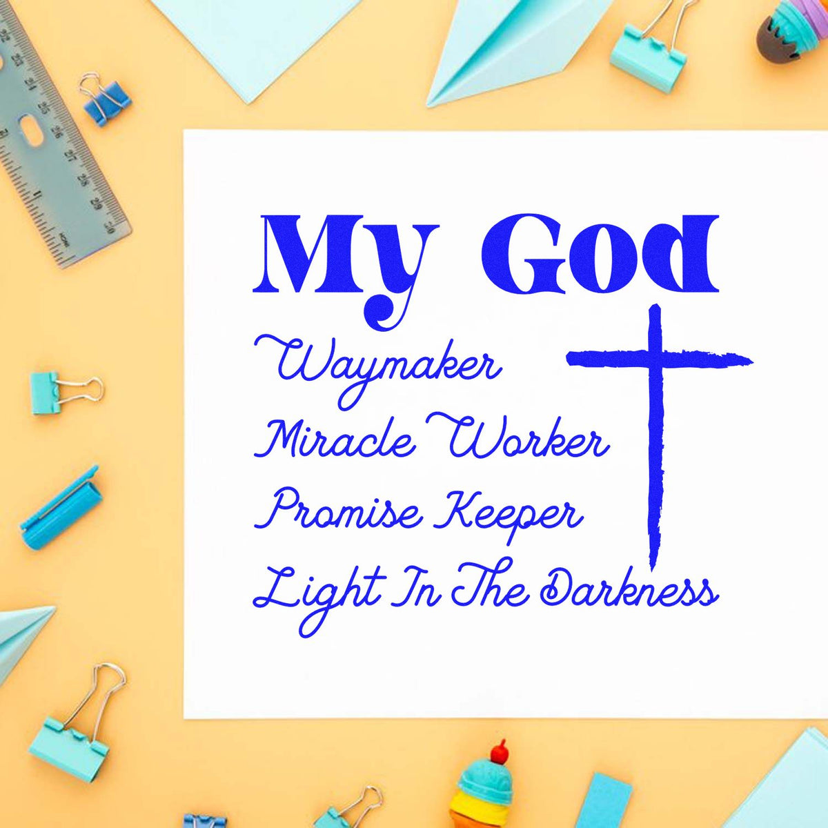 Blue stamp and seal design with cross and My God Waymaker, Miracle Worker, Promise Keeper, Light In The Darkness on white paper.