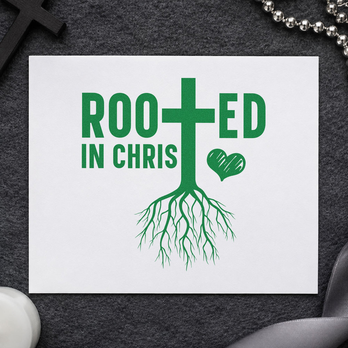 Rooted in Christ craft stamp imprint in green ink on a handmade project, one idea being plant pot labels.