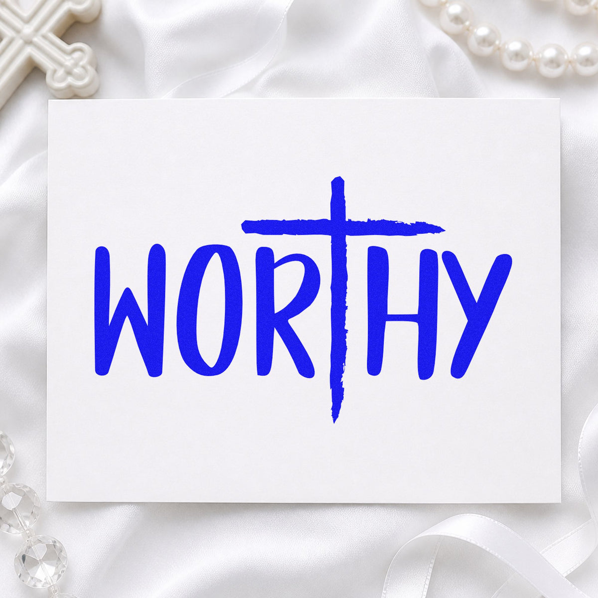 Worthy Cross craft stamp imprinted in blue ink on paper, a design suited to teen care packages.