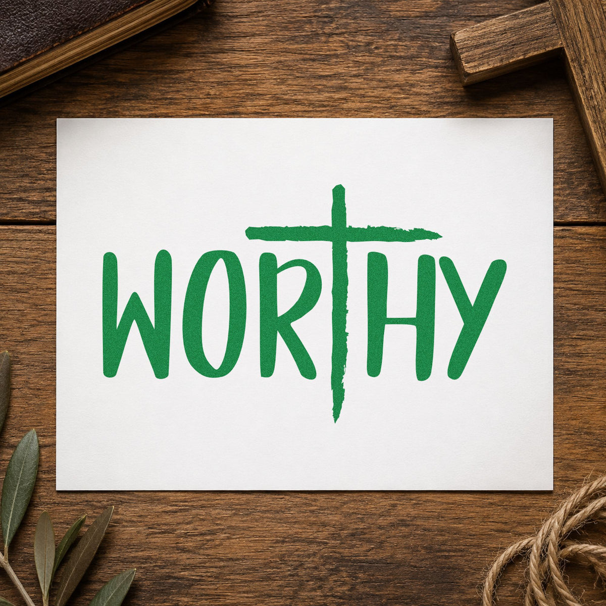 Worthy Cross craft stamp imprint in green ink on a handmade project, one idea being framed bedroom art.