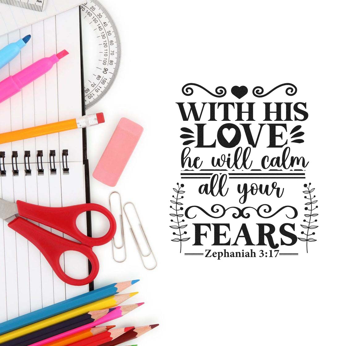 Black decorative stamp and seal with Bible quote, framed by colorful pencils, red scissors, pink eraser, and paper clips.