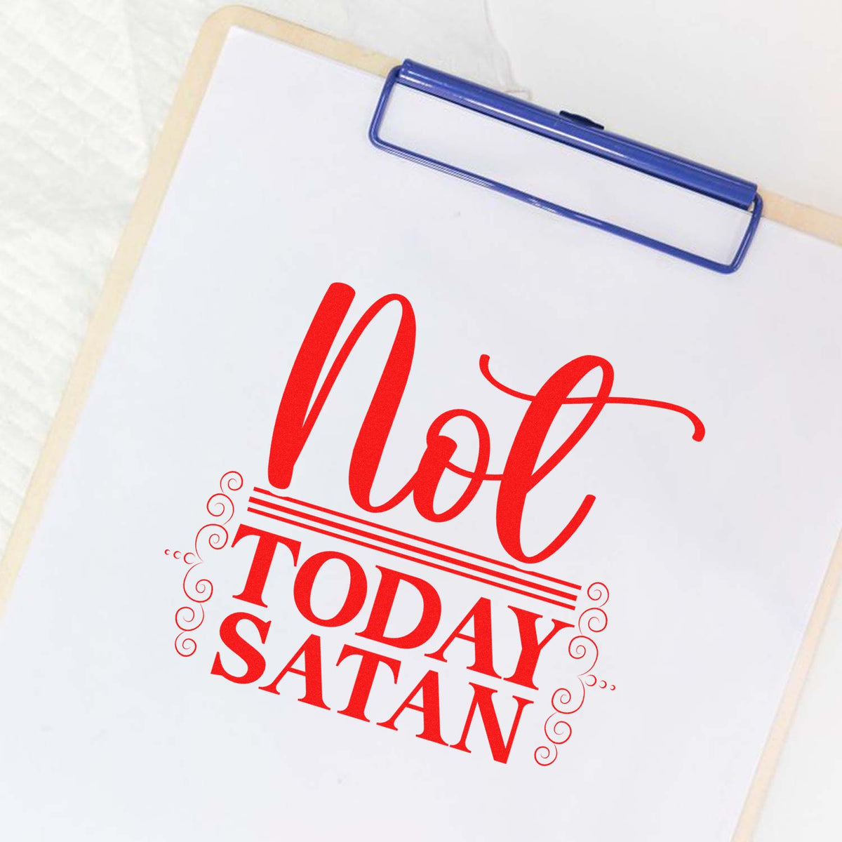 Red Not Today Satan stamp/seal design on white paper, clipped to a clipboard with a blue clip.