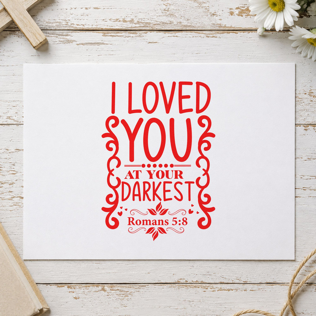Loved at Your Darkest Scrolls rubber stamp shown in red ink, stamped for projects such as journal cover stamping.