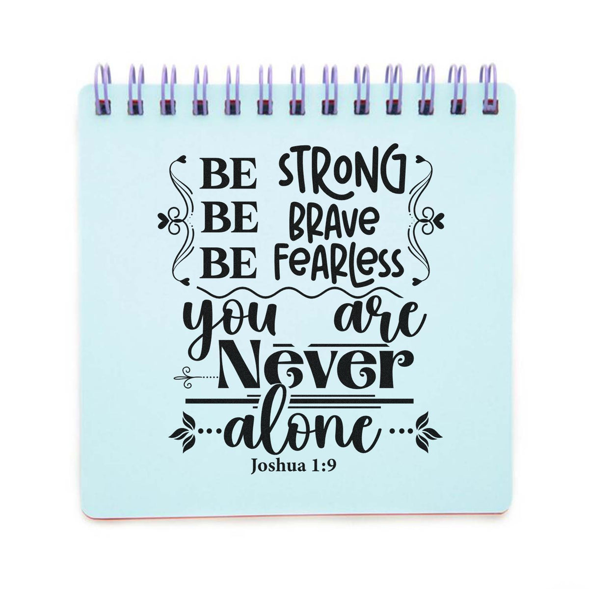 Light blue spiral stamp-and-seal notepad with black motivational quote, flourishes, and Joshua 1:9.
