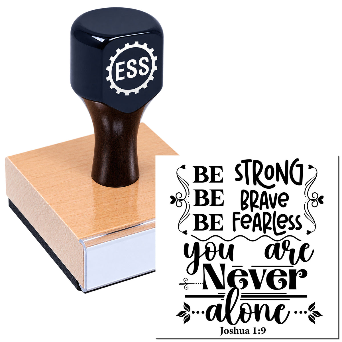 Black ESS rubber stamp on a wooden block, stamping a bold decorative seal with inspirational text in black.