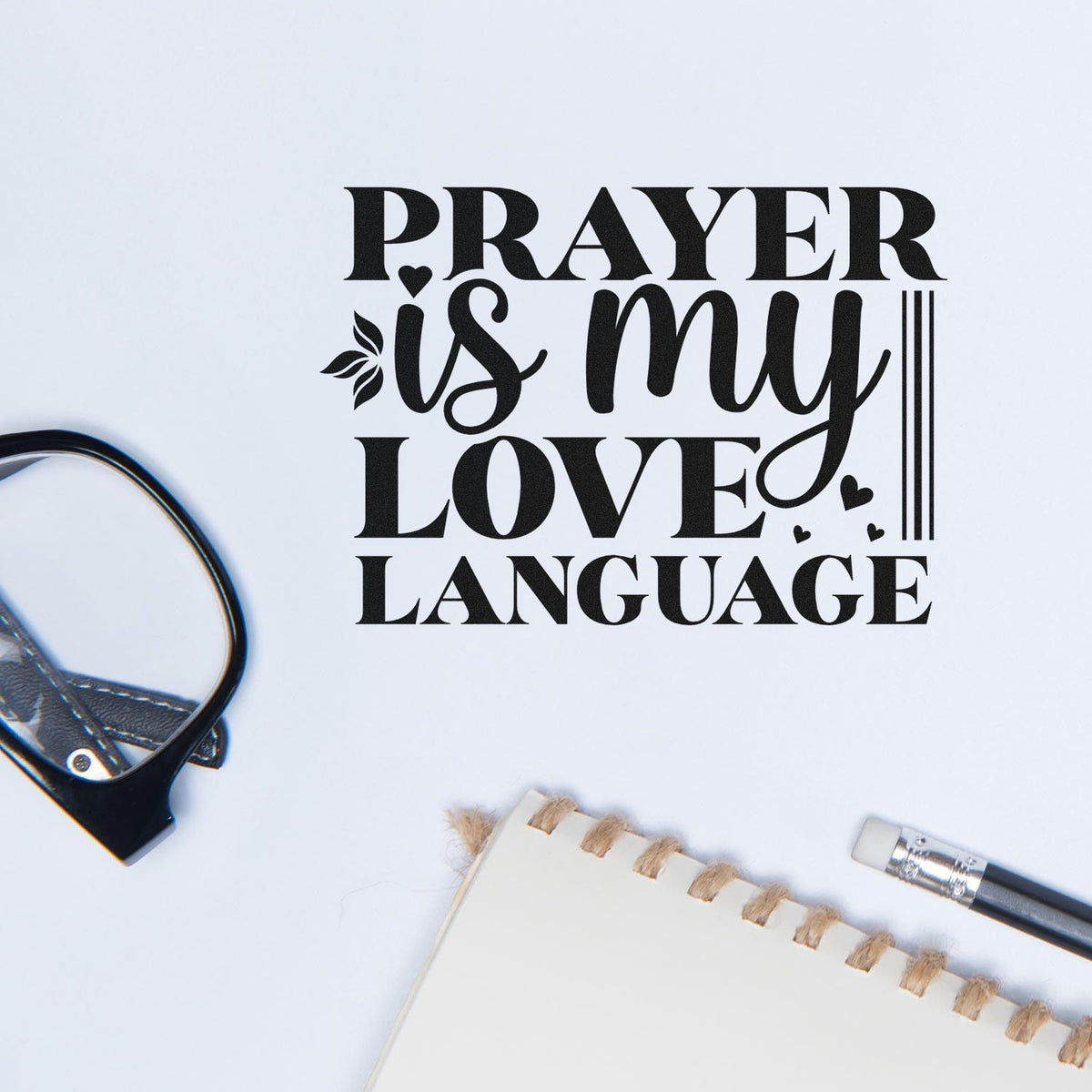 Black prayer-themed stamp and seal reading Prayer is my love language with hearts and leaf accents on white.