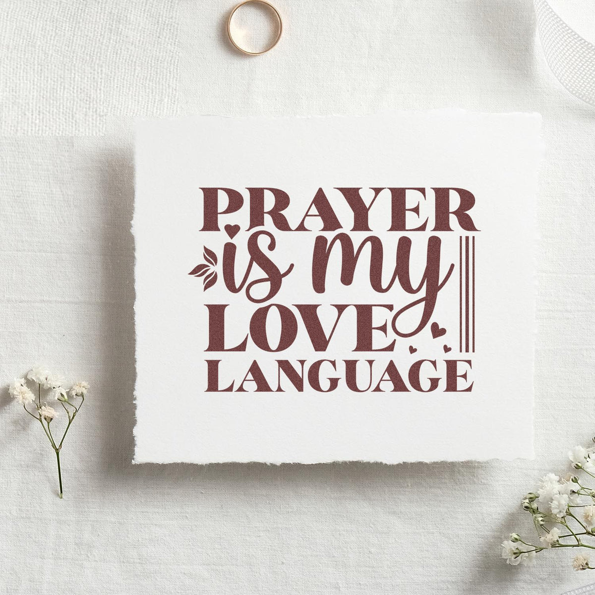 Rust-burgundy prayer love language stamp and seal design on white handmade paper with hearts and floral accents.