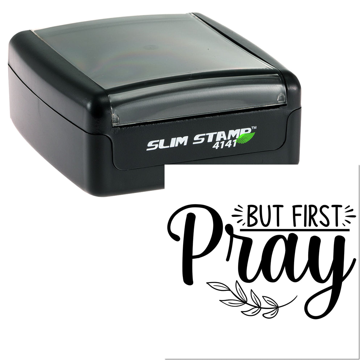 Black self-inking slim stamp and seal with clear cap, printing But First Pray in bold black script with leaf accent.