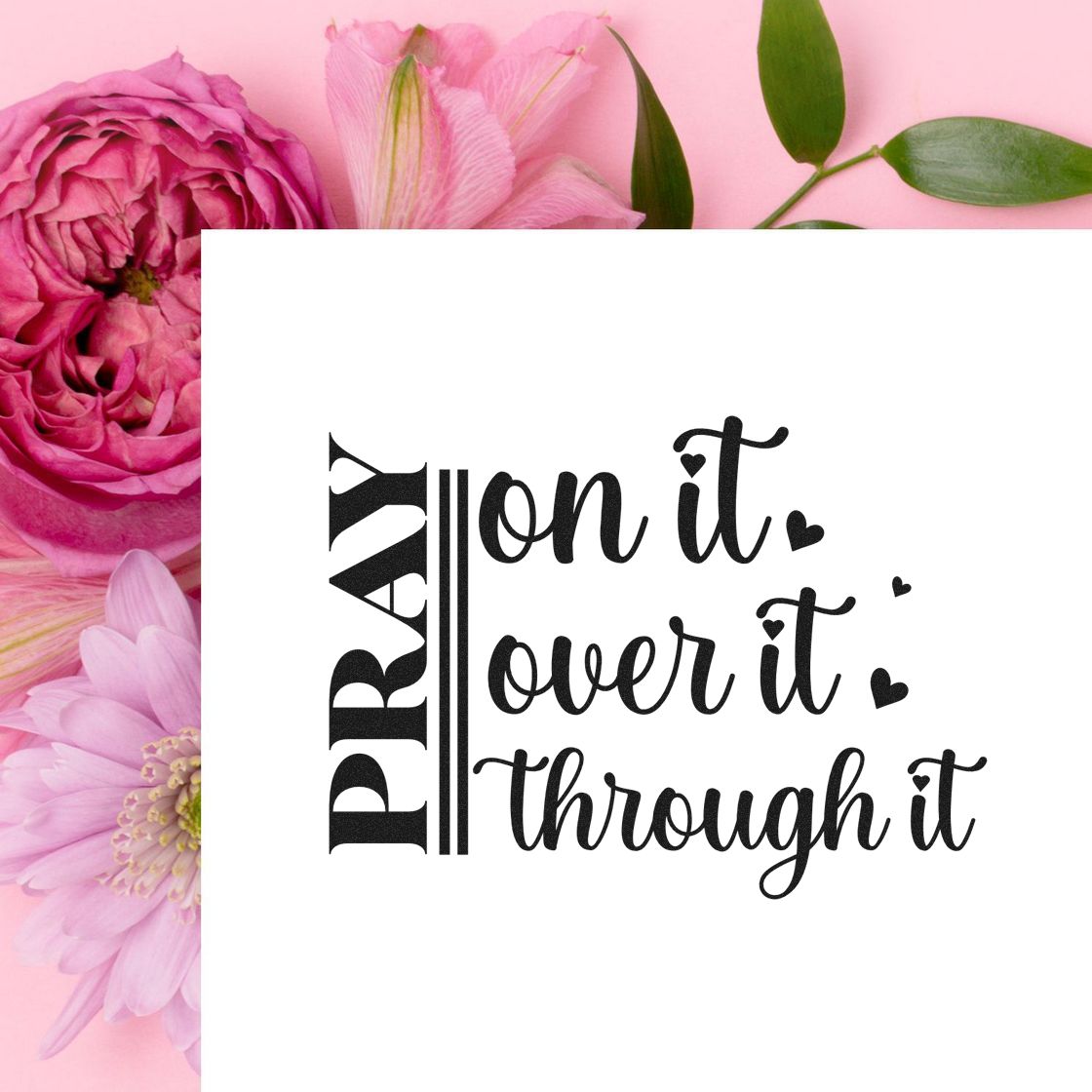 Black prayer stamp design on white card, framed by pink flowers on a pastel pink background.
