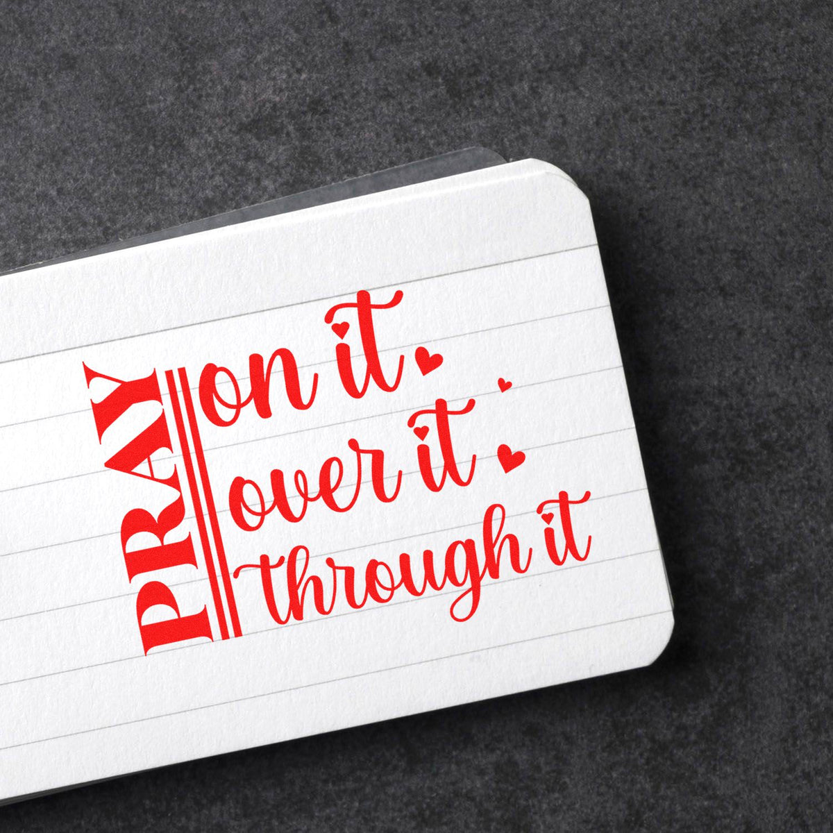 Red custom rubber stamp and seal reading PIRATE and All on it, Lover it, through it on white lined card.