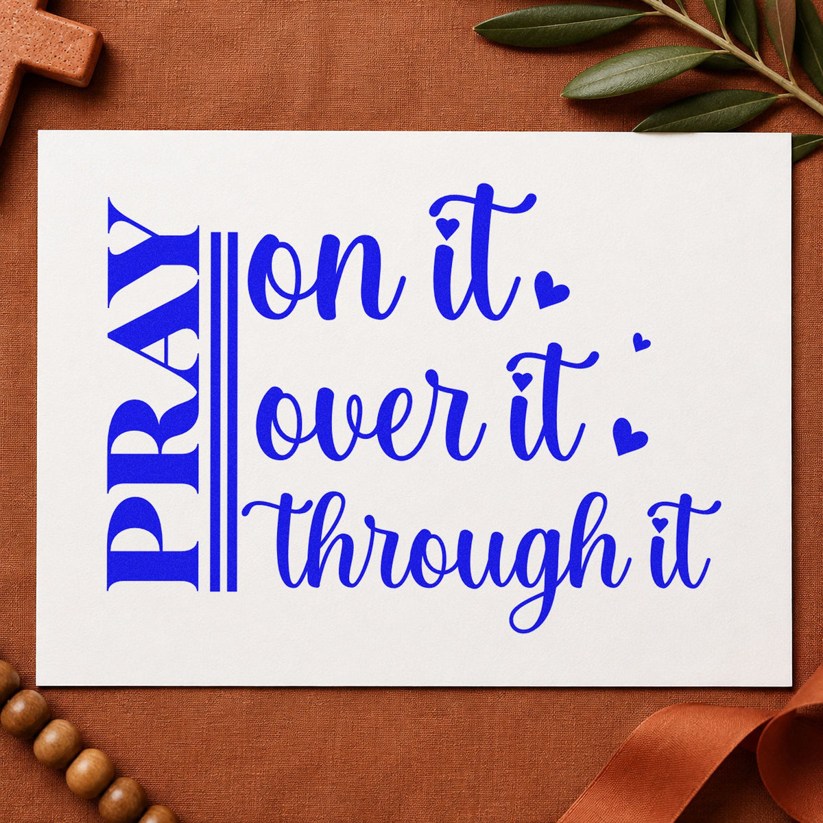 Pray on It Heart Script craft stamp imprinted in blue ink on paper, a design suited to women's group notes.