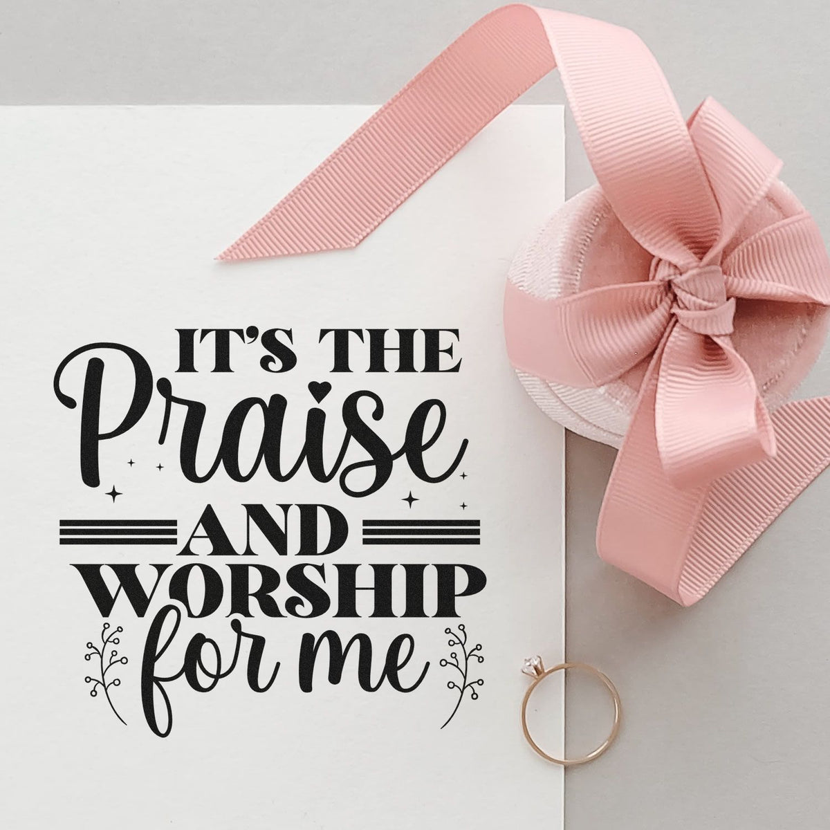 White stamp with black Its the Praise and Worship for me text, pink ribbon wax seal, and rose-gold ring.