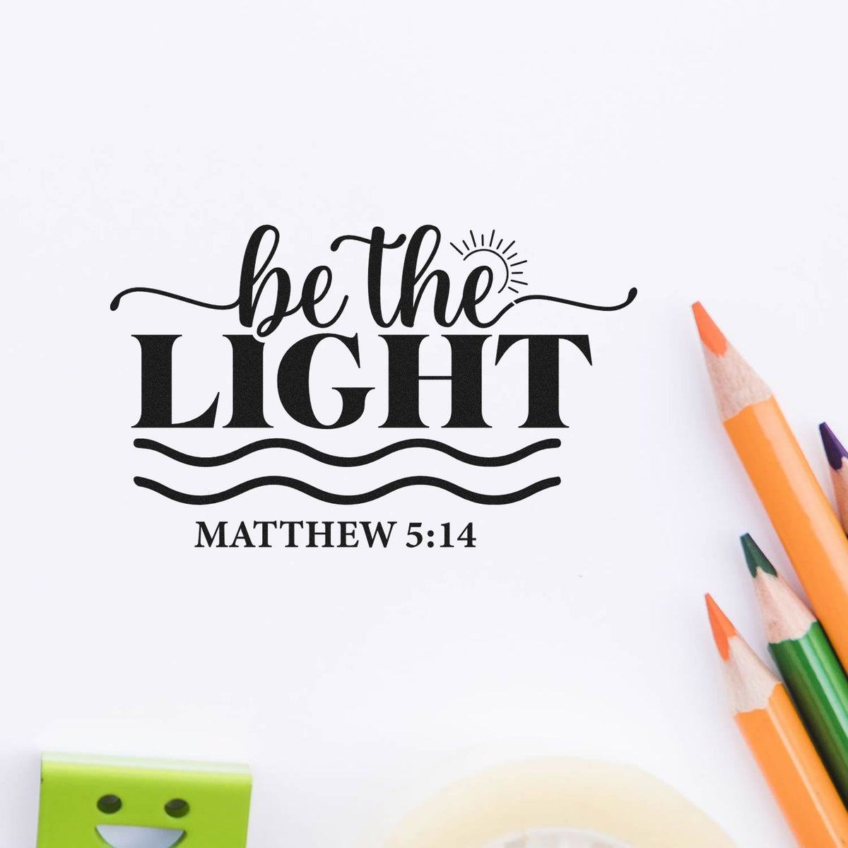 Black be the LIGHT Matthew 5:14 stamp and seal design on white background with orange and green pencils.